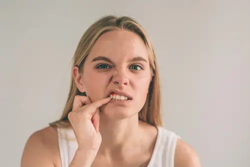 woman with gum pain